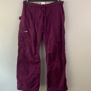 Koi Lindsey scrub pants in plum/purple color